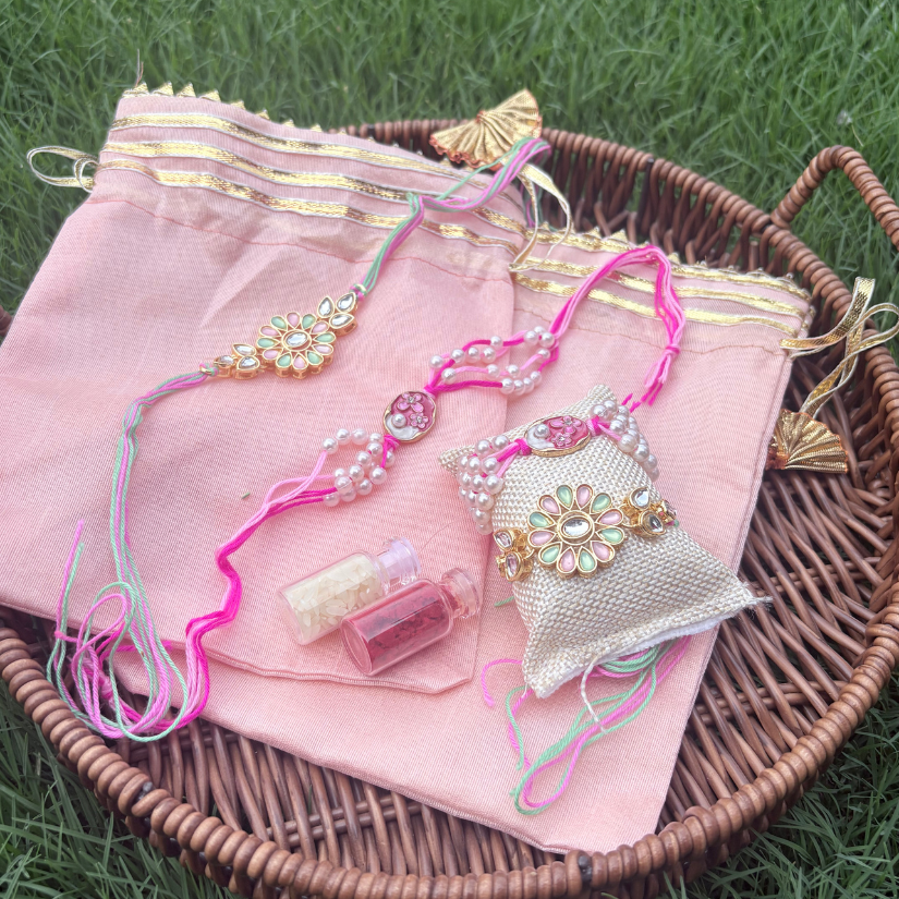 Kundan and moti rakhi with roli and akshat in a premium Rajasthani silk potli