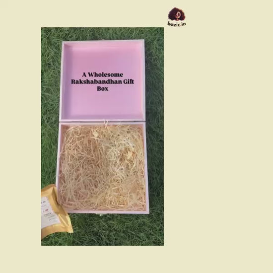 Bazic Raksha Bandhan gift box with two rakhis, millet mithai, namkeen and cookies